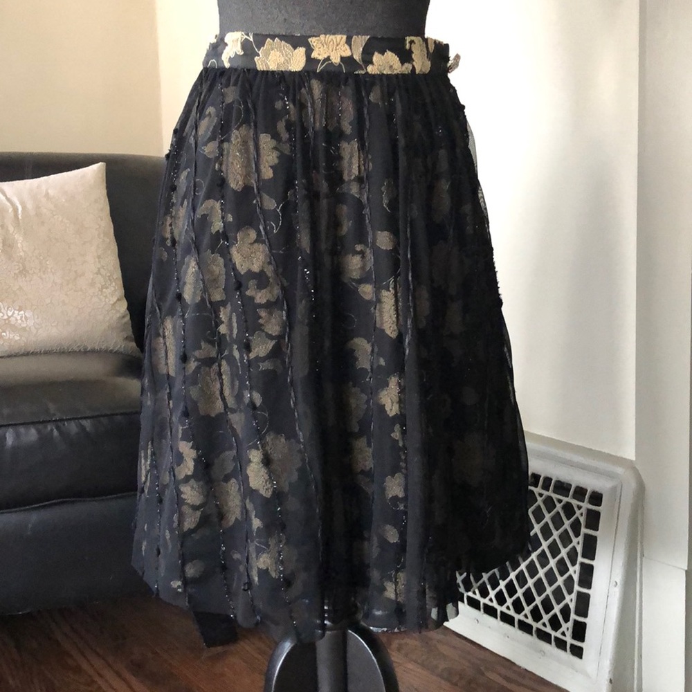 Cirque de Soleil layered skirt, in gold and black.